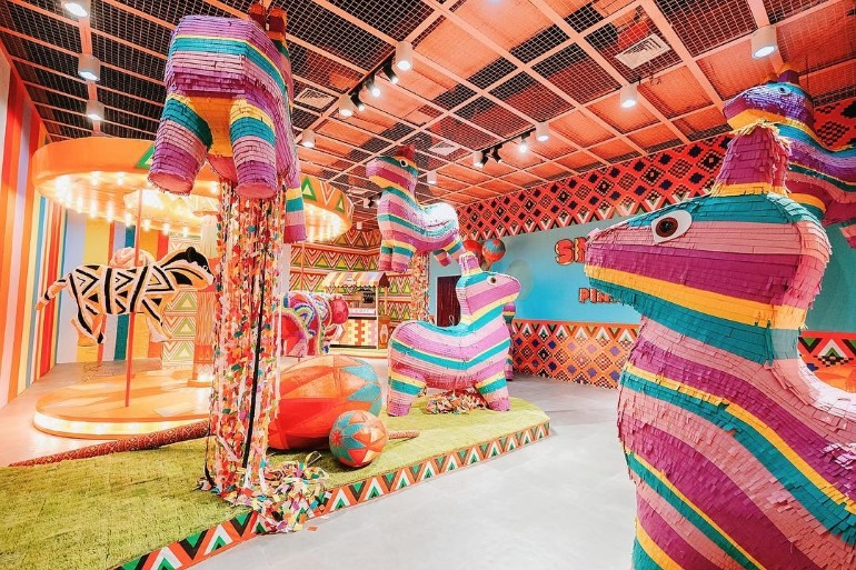 pinata-pit-room-interior-colorful-giant-pinata-carousel-dessert-museum