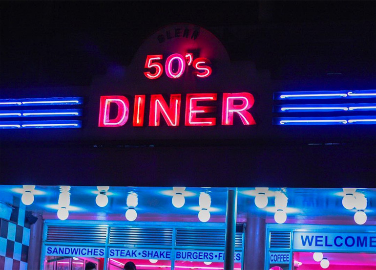 50s diner exterior with neon signage