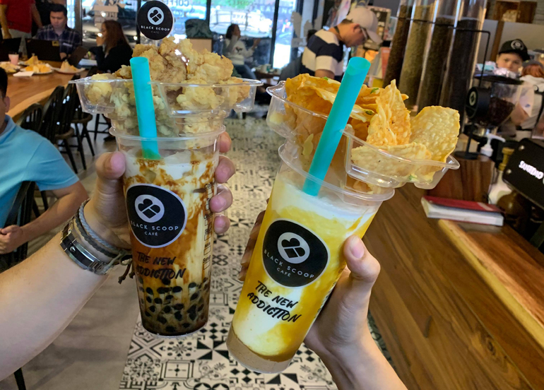 Black Scoop Milk Tea with a combination of chicken poppers and chips