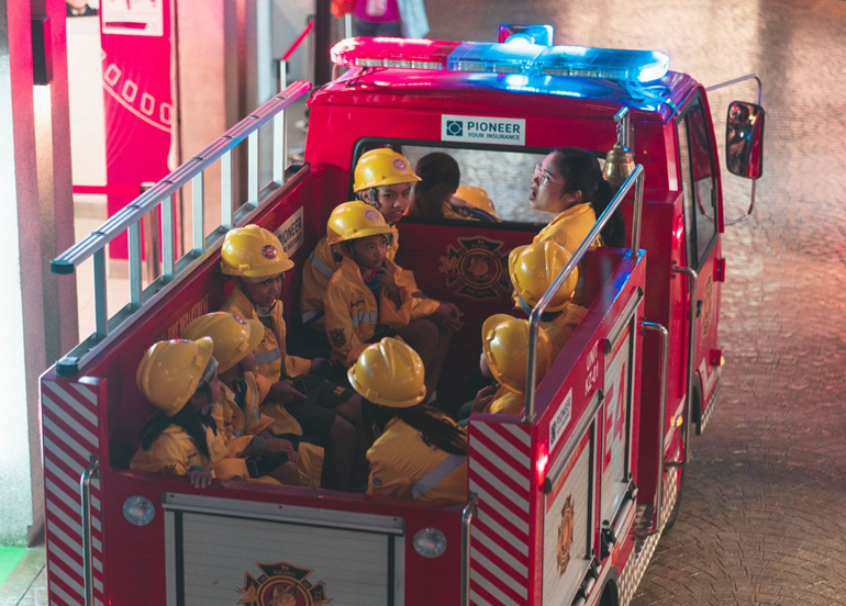 Kids at Work inside a firetruck