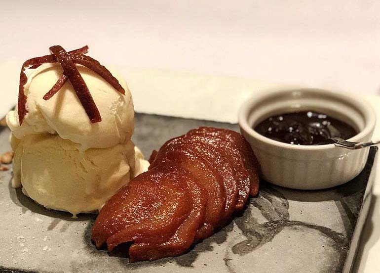 Poached Pears with Orange Suace and Vanilla Ice Cream from House of Wagyu Stone Grill