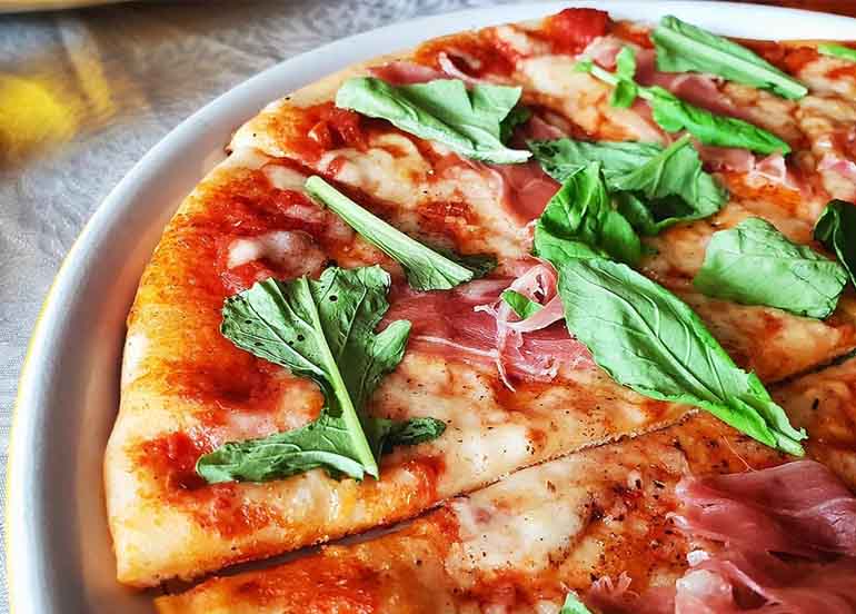 Parmaham Arugula Pizza from Bellini's