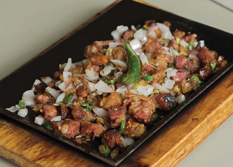 Sizzling Lechon Sisig from Hukad by Golden Cowrie