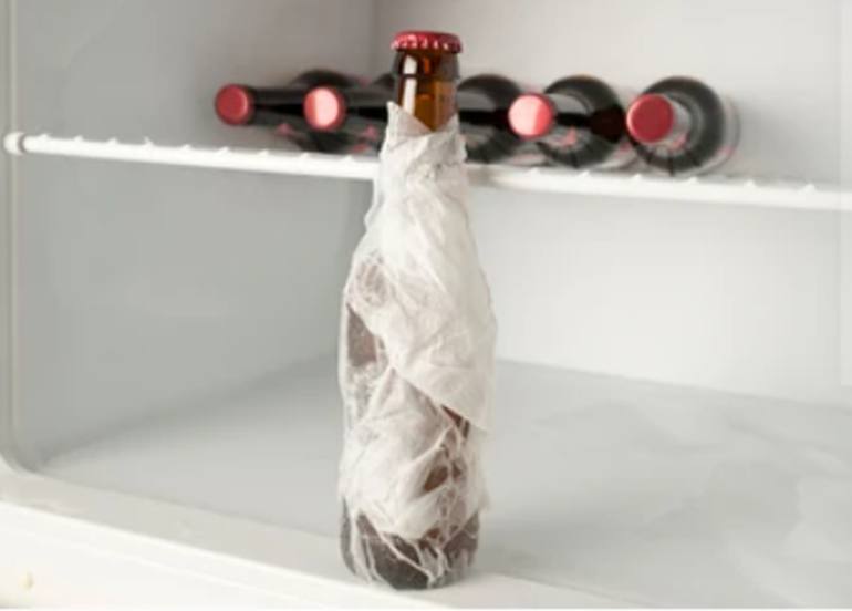wet paper towel around bottle